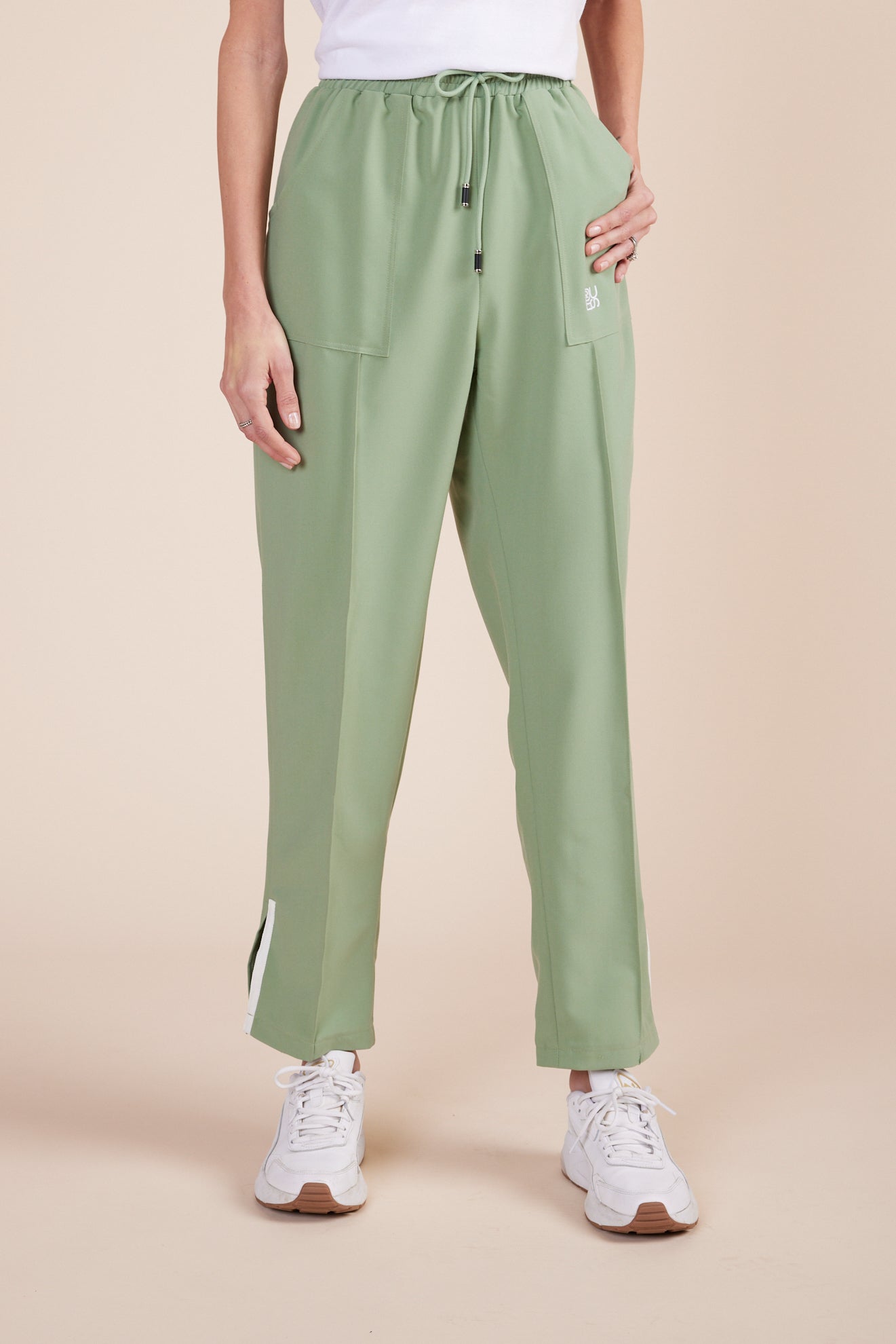 Lynn Joggers in Green Tea by DUES – luxury scrub joggers sewn in the USA, designed for healthcare professionals seeking comfort, durability, and a polished athletic-inspired silhouette.