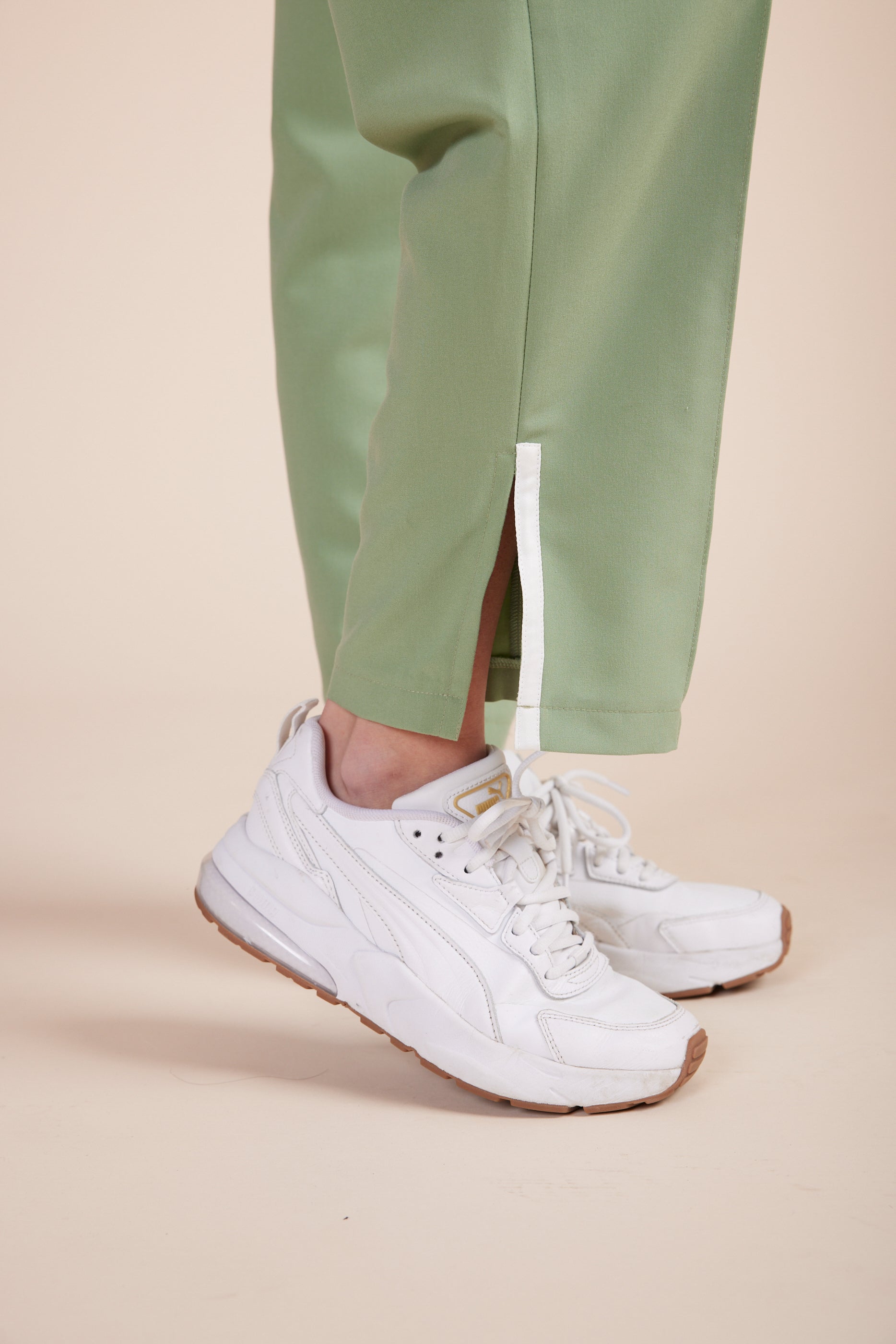 Lynn Joggers in Green Tea by DUES – luxury scrub joggers sewn in the USA, designed for healthcare professionals seeking comfort, durability, and a polished athletic-inspired silhouette.