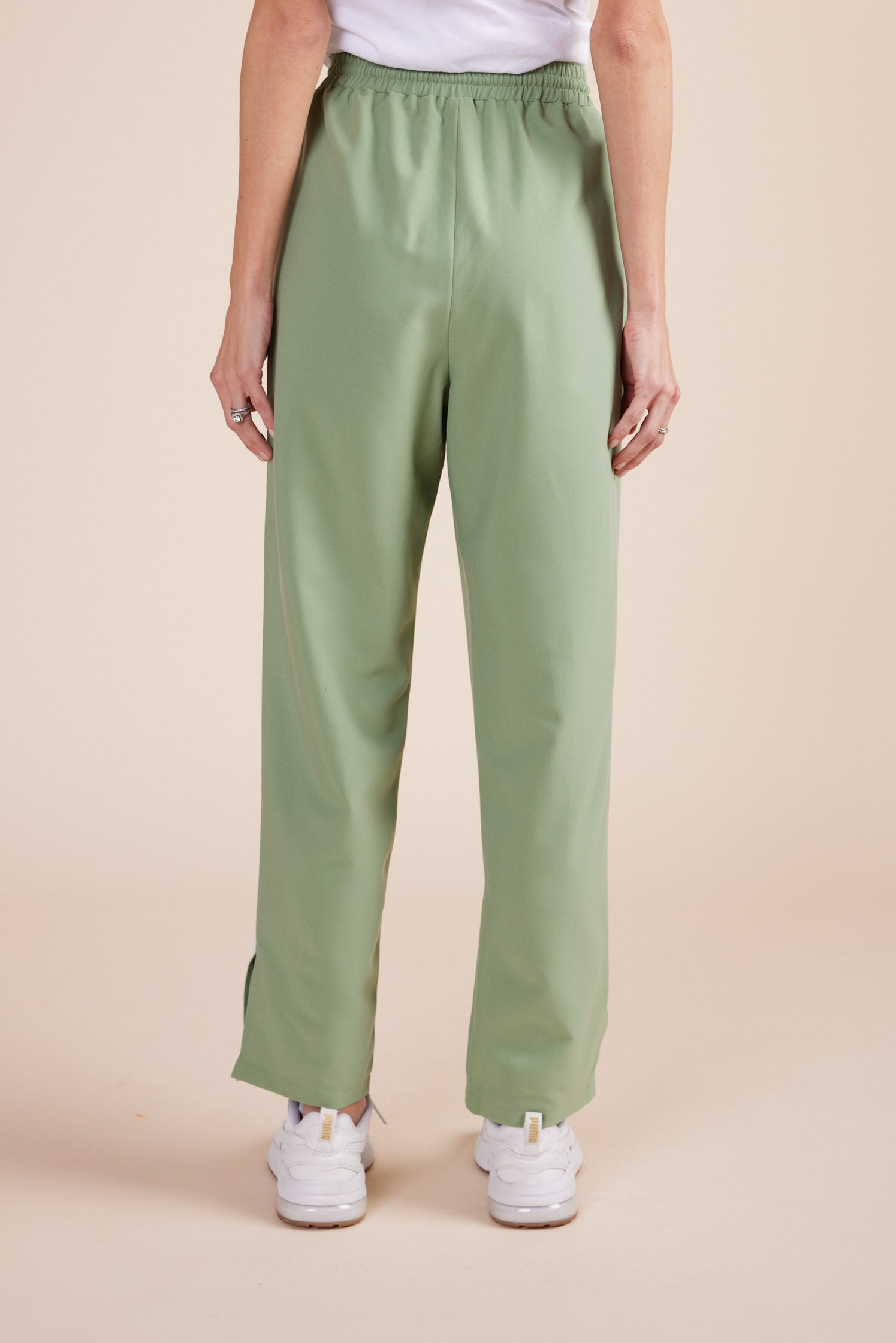Lynn Joggers in Green Tea by DUES – luxury scrub joggers sewn in the USA, designed for healthcare professionals seeking comfort, durability, and a polished athletic-inspired silhouette.