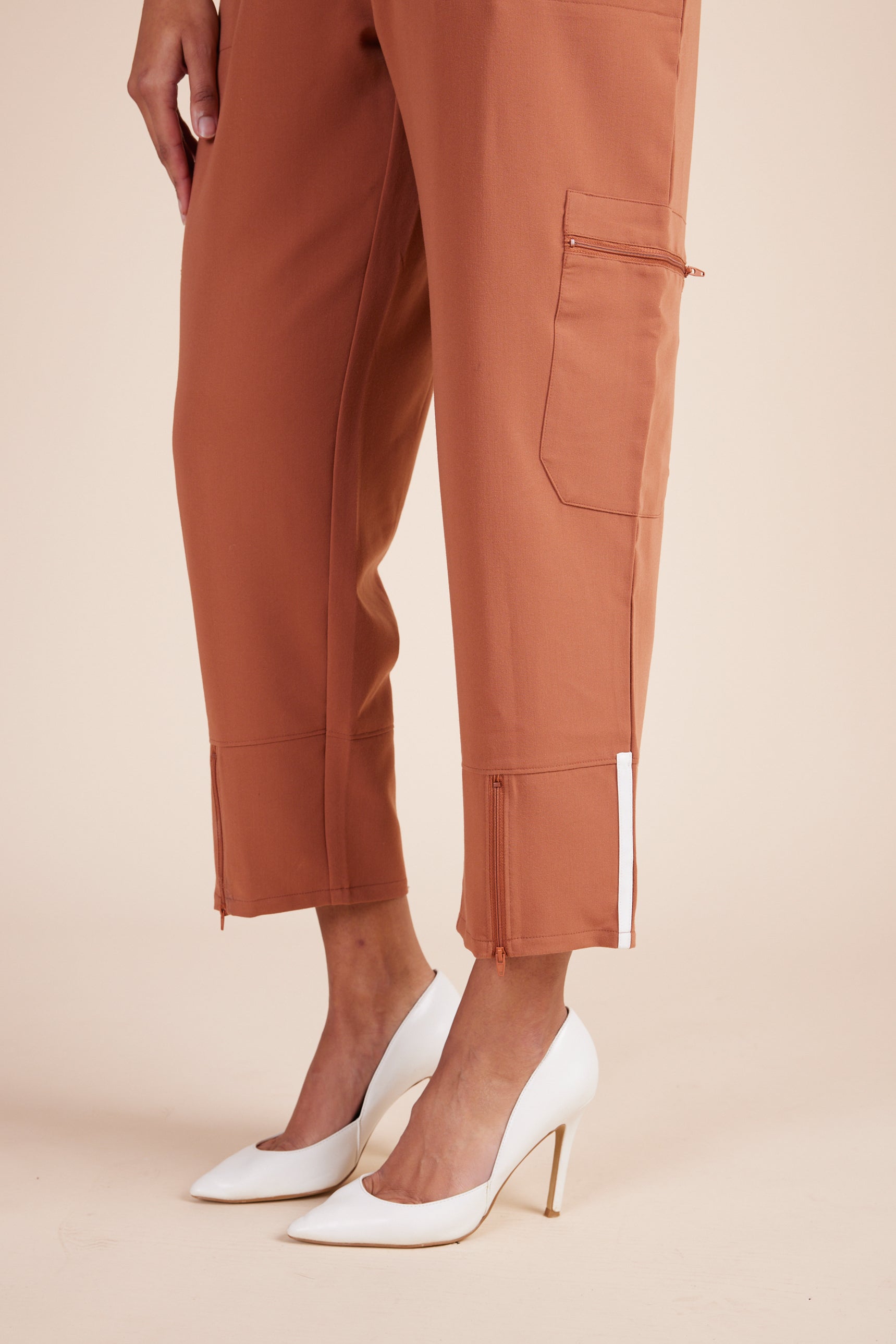 Ebony Scrub Jumpsuit in Terracotta by DUES – luxury scrub jumpsuit sewn in the USA, offering a polished one-piece design with breathable, high-performance fabric for ultimate comfort.