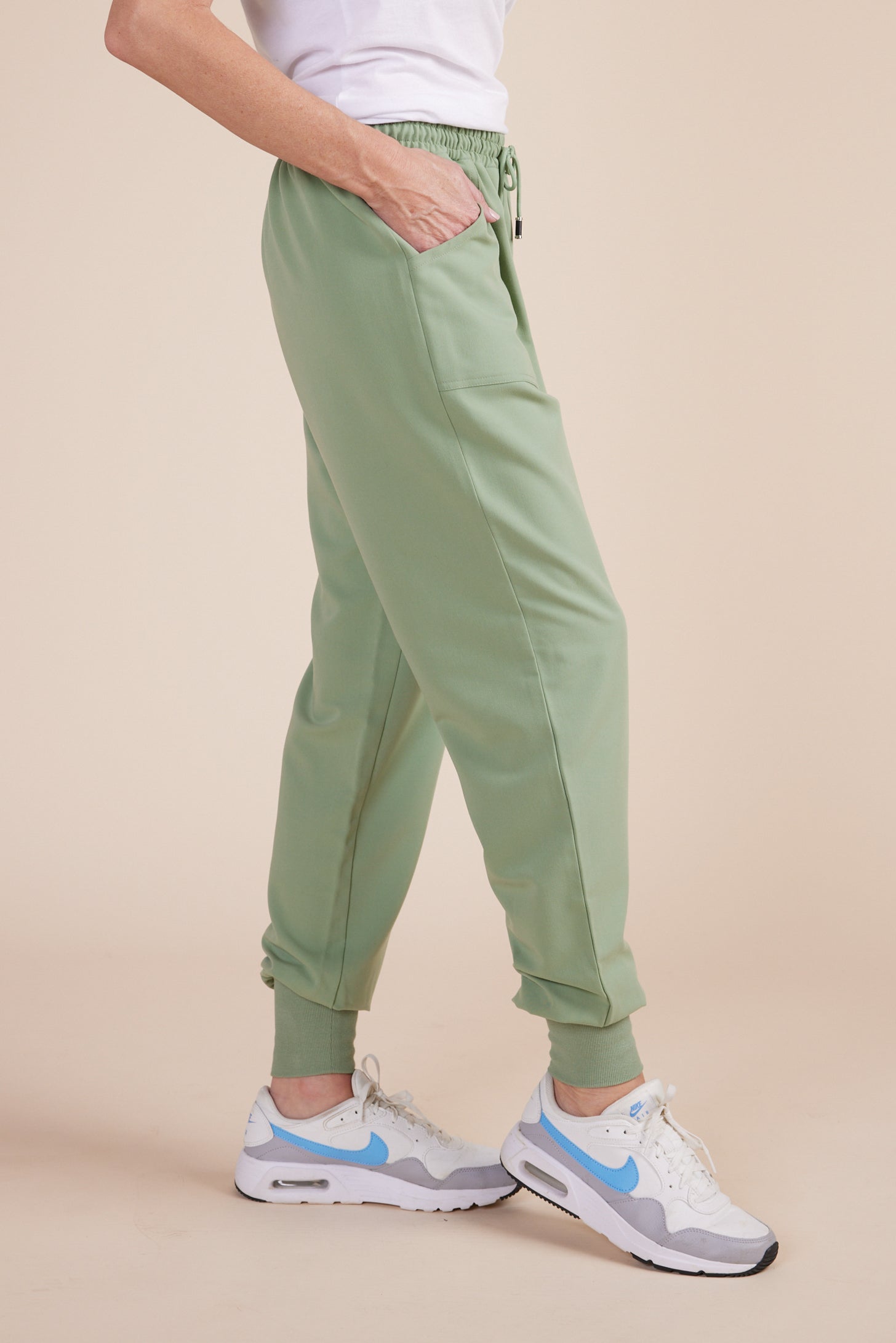 Mache Joggers in Green Tea by DUES – luxury scrub joggers sewn in the USA, combining modern streetwear style with medical-grade functionality and comfort.