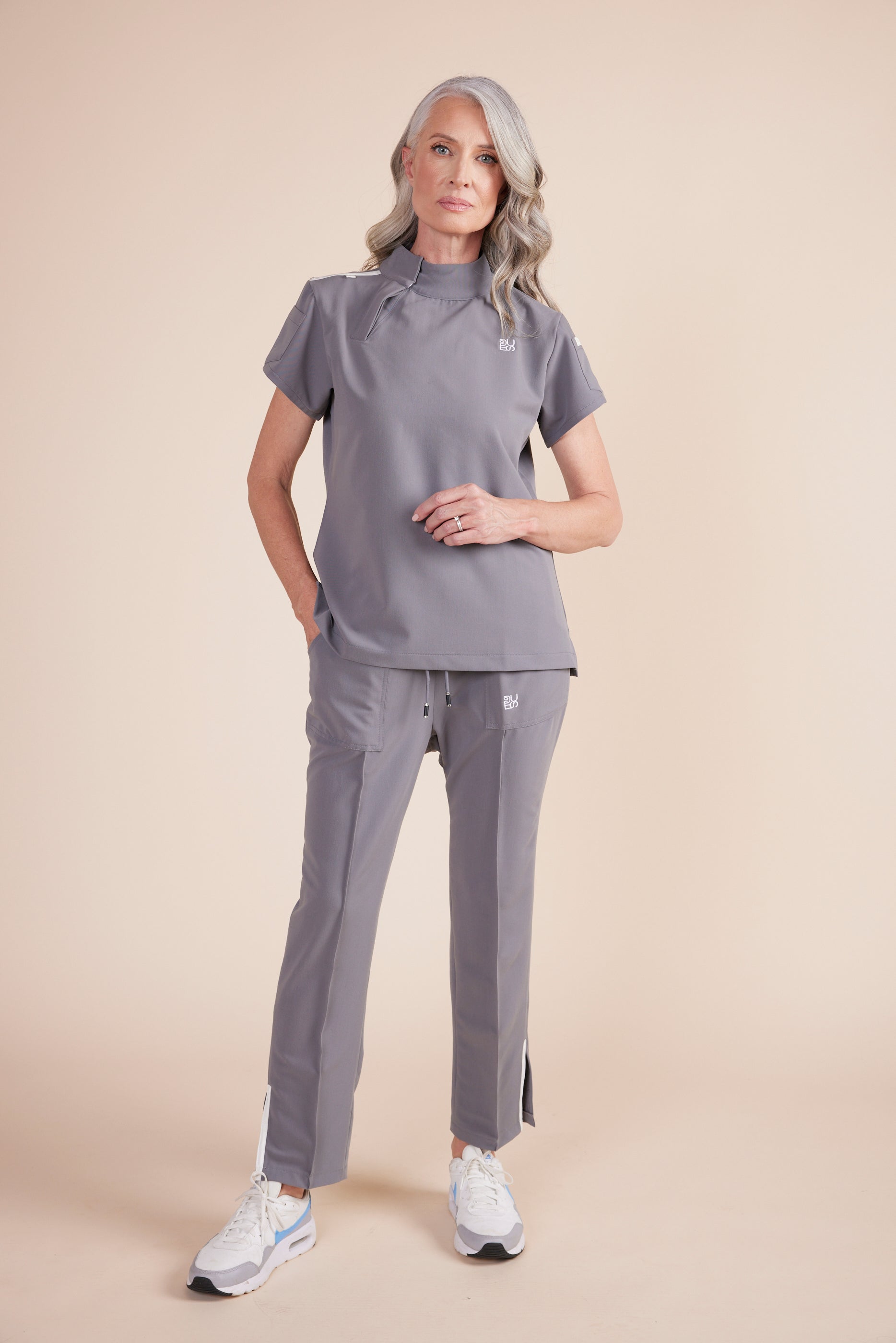 Lynn Joggers in Gray by DUES – luxury scrub joggers sewn in the USA, crafted for superior comfort with high-stretch material, tapered legs, and streamlined storage solutions.