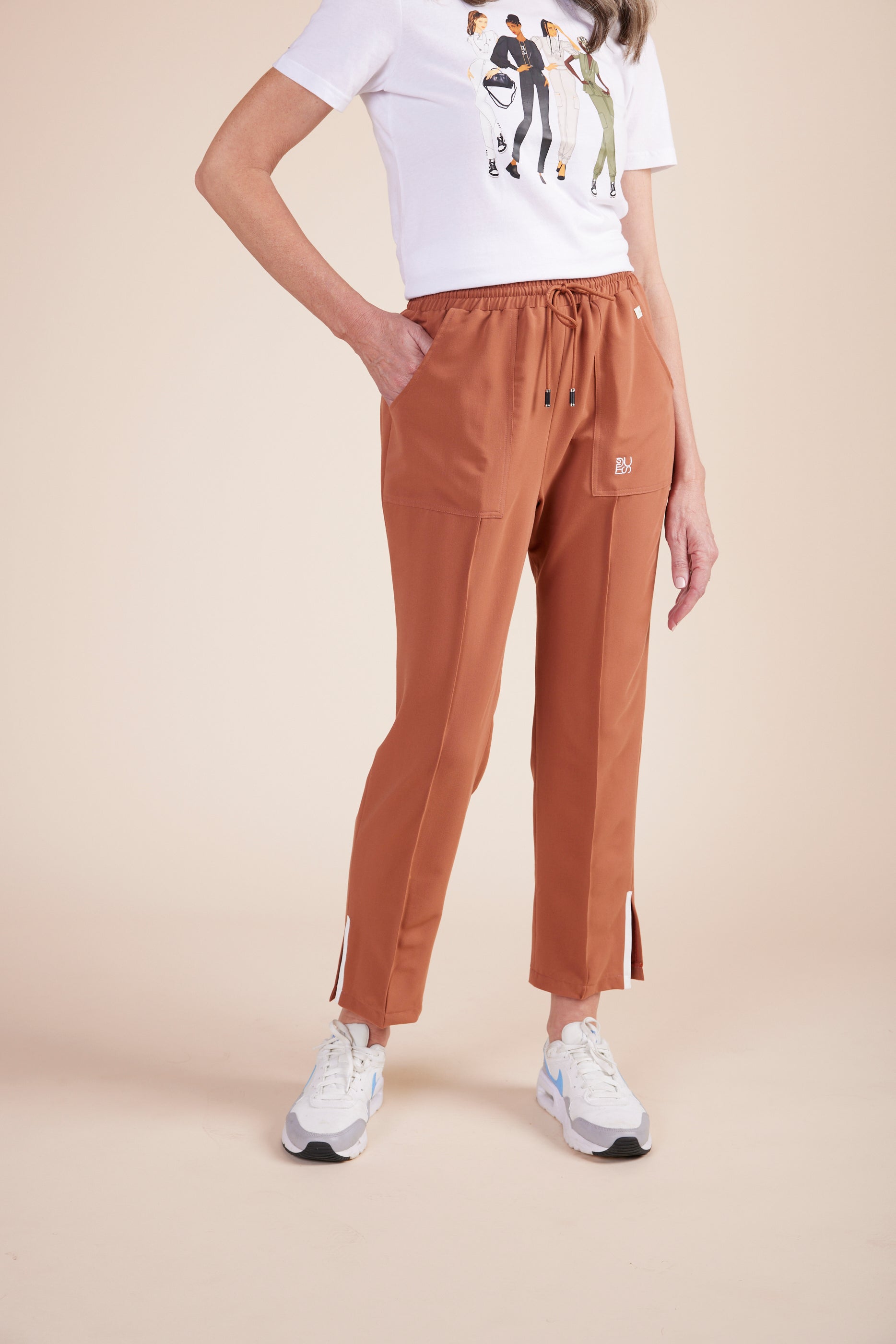 Lynn Joggers in Terracotta by DUES – luxury scrub joggers sewn in the USA, designed for healthcare professionals seeking comfort, durability, and a polished athletic-inspired silhouette.