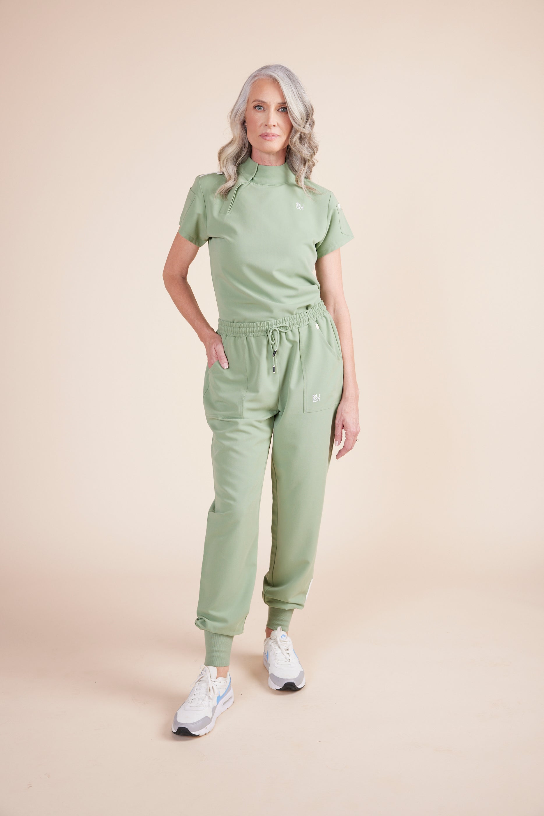 Mache Joggers in Green Tea by DUES – luxury scrub joggers sewn in the USA, combining modern streetwear style with medical-grade functionality and comfort.