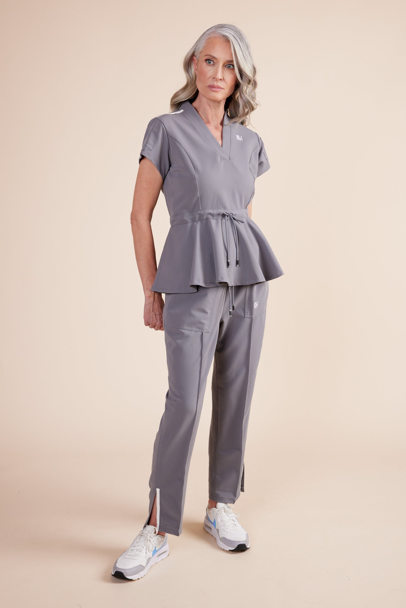 Lynn Joggers in Gray by DUES – luxury scrub joggers sewn in the USA, designed for healthcare professionals seeking comfort, durability, and a polished athletic-inspired silhouette.